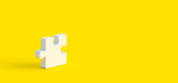 istock Unfinished one white jigsaw puzzle on yellow background with copy space 1191971219