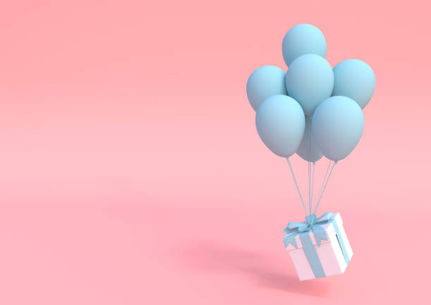 istock White gift box with blue ribbon and balloon on pastel pink background 1191971421