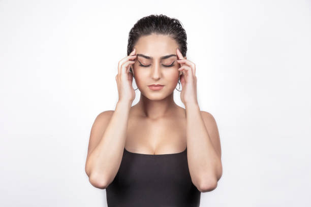istock stressed woman is holding her face. 1191971427