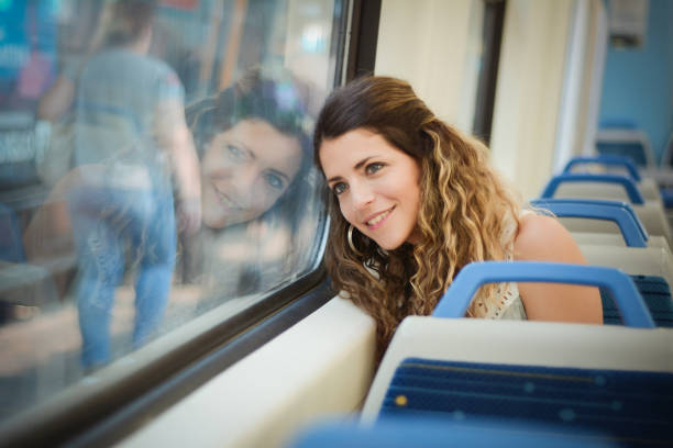 istock Young woman traveling by train 1191973392