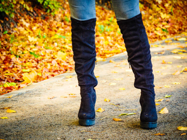 istock Woman wearing black knee high boots 1191978547