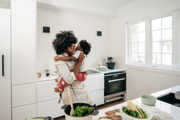 istock Mom and daughter having fun on the kitchen 1191982362