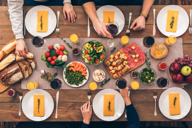 istock People sitting at home behind table with food 1191982661