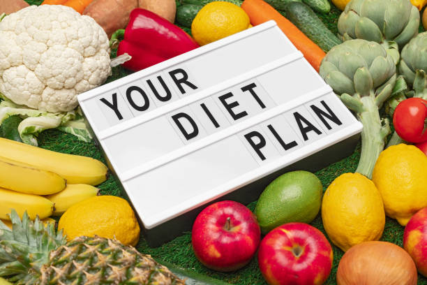 istock Assorted diet food near board with inscription 1191982730