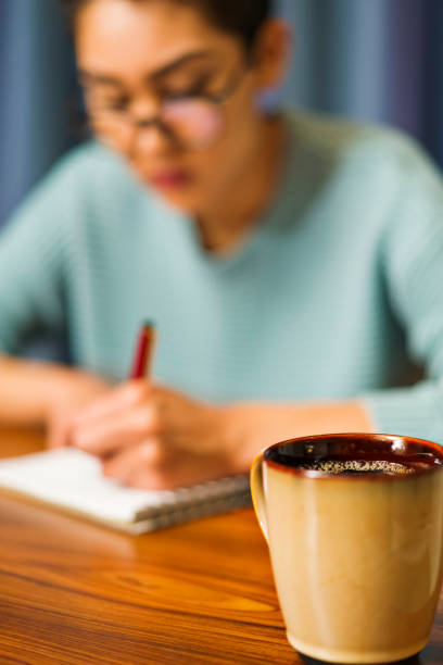 istock Pretty girl writing in Journal 1191983334