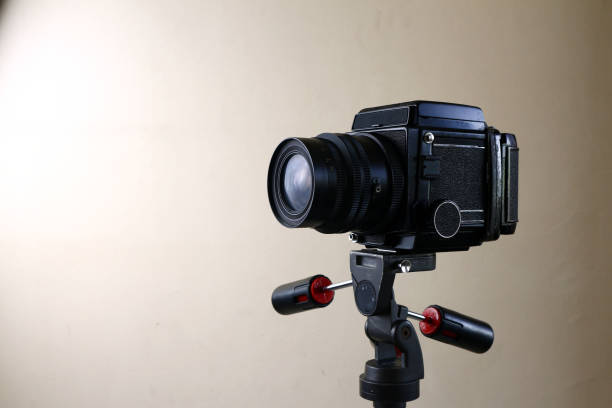 Photo of an old and vintage medium format film camera on a tripod