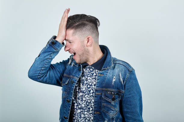 istock Young handsom man keeping his hand on head, like decision has come 1191985908