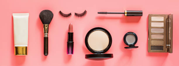 istock Make up items on pink color background. Horizontal web banner. Set of luxury decorative cosmetics flat lay, top view, mockup, template. Minimal style. Beauty blogger concept 1191990017