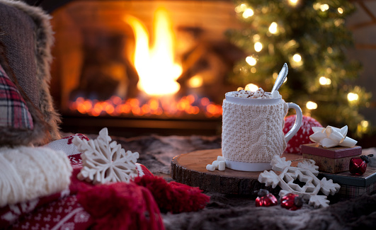Christmas cozy hot chocolate in front of the fireplace