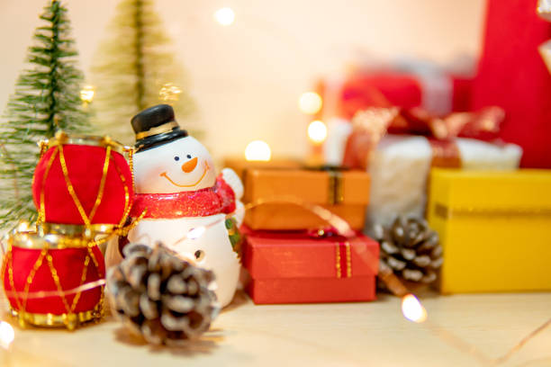 istock Smiley snowman toy with Christmas decoration 1191991354