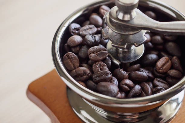 istock Vintage manual coffee grinder with roasted coffee beans 1191993184