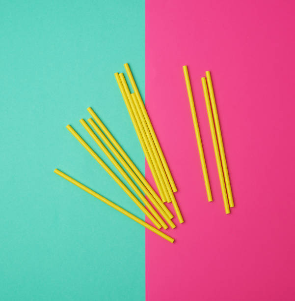 istock stack of yellow paper tubes for a cocktail on a multi-colored background 1191993726