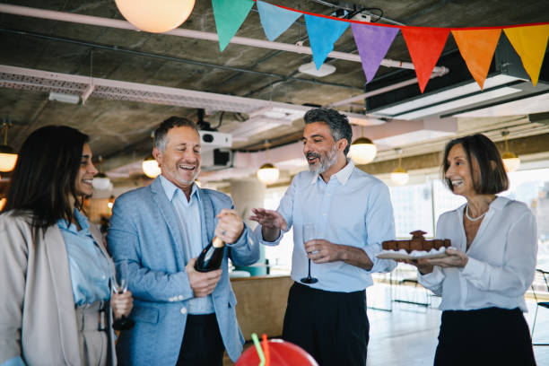 istock Opening champagne at the office birthday party 1191994465