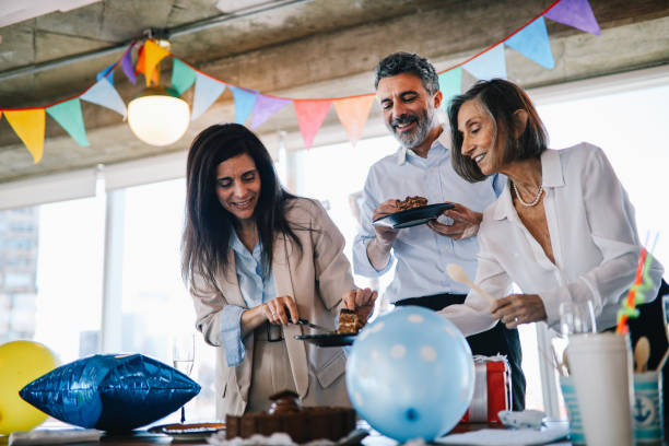 istock Colleagues eating cake at the office birthday party 1191994848