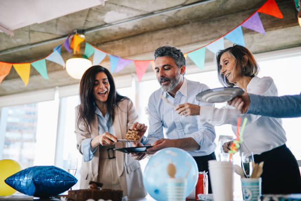 istock Colleagues eating cake at the office birthday party 1191995403