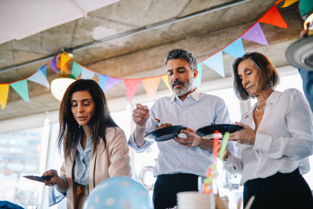 istock Colleagues eating cake at the office birthday party 1191995430