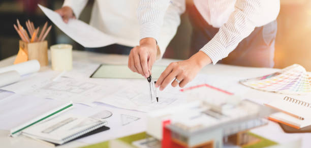 istock Cropped shot of architect and engineer working together on construction project 1191996623