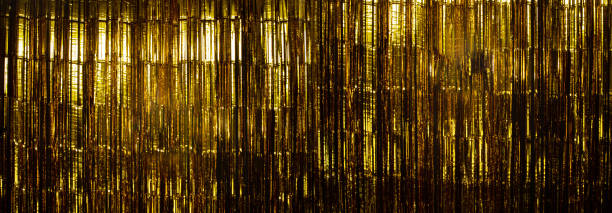 istock Gold Foil strip Curtain hanging on wall studio 1191996770