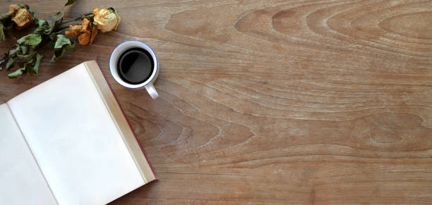istock Top view of comfortable workplace with open notebook, coffee cup and copy space 1191996828