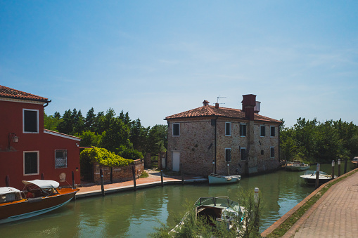 Houses by canal on island of Torcello, in Venice, Italy