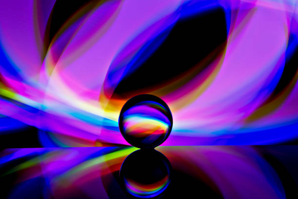 istock Abstract background with light reflecting from behind a glass ball 1191999874