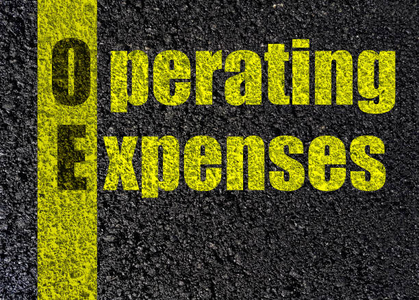 istock operating expenses text,  asphalt black   top view road  background 1192003501