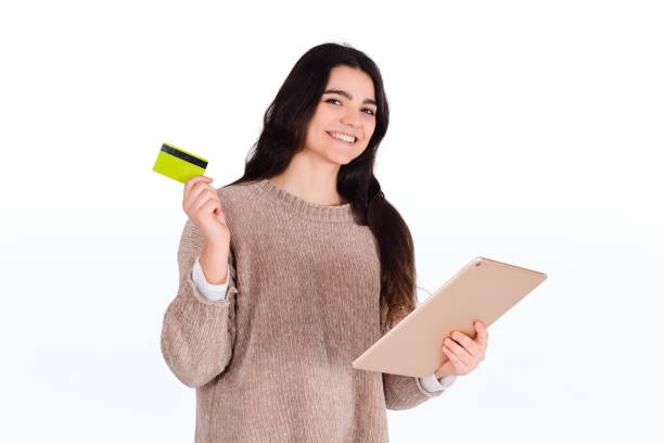 istock Woman with credit card and digital tablet. 1192004637