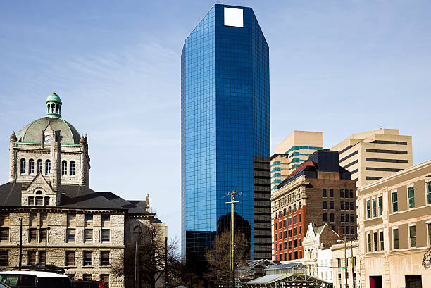 The Art Deco Courtyard by Marriott in downtown Fort Worth, Texas USA reflects in the glass exterior of 777 Main