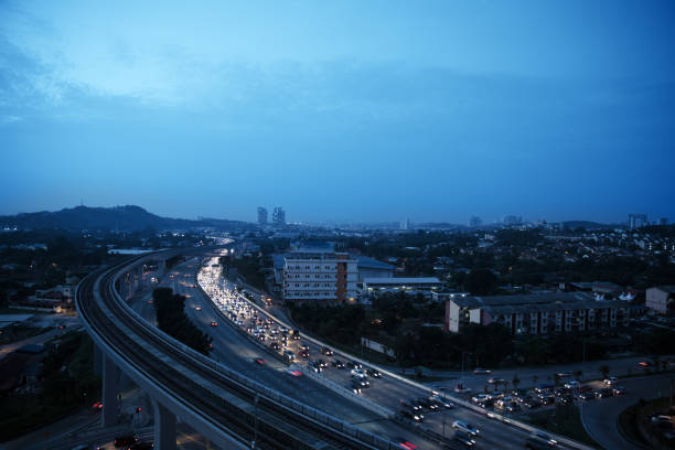 Aerial view of traffic jam at toll on expressway in sunrise. Aerial view of traffic jam at toll on expressway in sunrise. Top view, cityscape. Sky in classic blue color 2020. indigo truck stock pictures, royalty-free photos & images