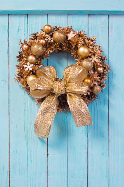 istock Christmas wreath on old blue  wooden background 1192007753