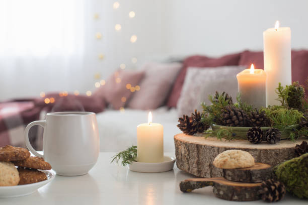 istock cup of tea with burning candles on white table 1192007846