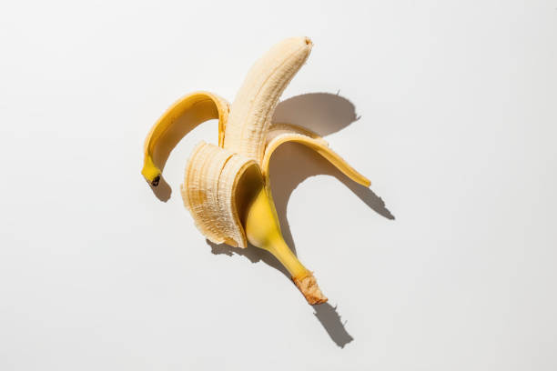 istock Peeled banana on white background 1192010343