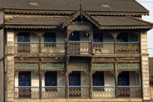 istock Old two story abandon building and traffic on the same road 1192014508