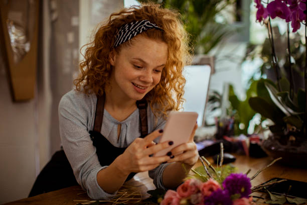 istock Young Woman using a Phone 1192022163