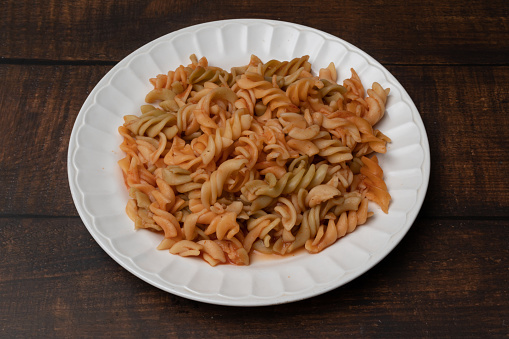 Penne pasta on a plate with sauce