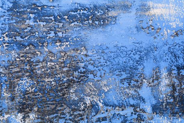 istock blue large holes on aged plaster texture - nice abstract photo background 1192023083