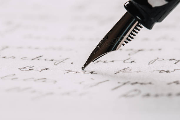istock fountain pen on paper with ink text closeup 1192023234