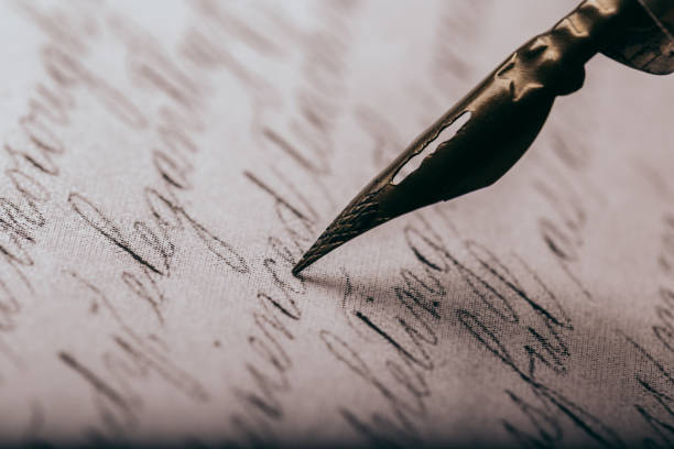 istock fountain pen on paper with ink text closeup 1192023359