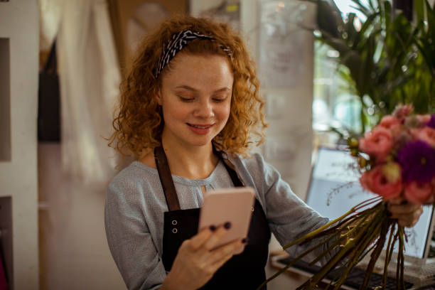 istock Young Woman using a Phone 1192023457