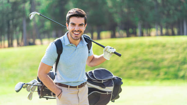 istock Male golfer standing on golf course 1192024371