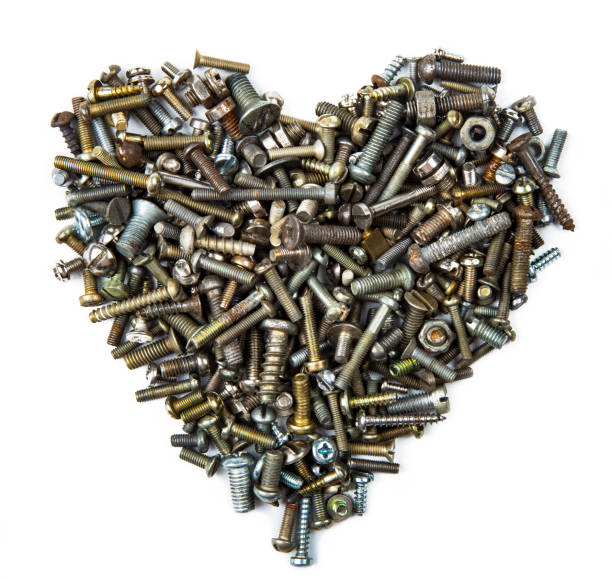 istock A heart shaped figure laid out from various assorted rusty metal old bolts, screws, nails, nuts. The concept of metallic artificial heart machine, robot, mechanism. The concept of Valentine's Day, strong eternal love. 1192026885