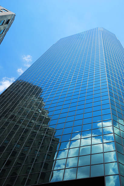 istock Skyscraper with reflection of cloud and building 119202840