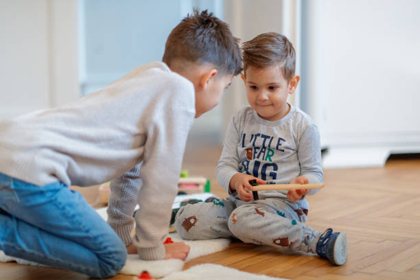 istock Siblings playing with toys 1192029046