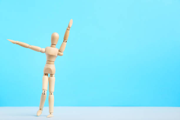 istock Wooden figure on blue background 1192030061