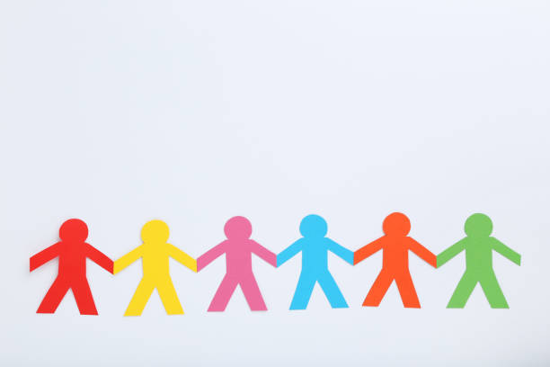 istock Colorful paper chain people on white background 1192030438