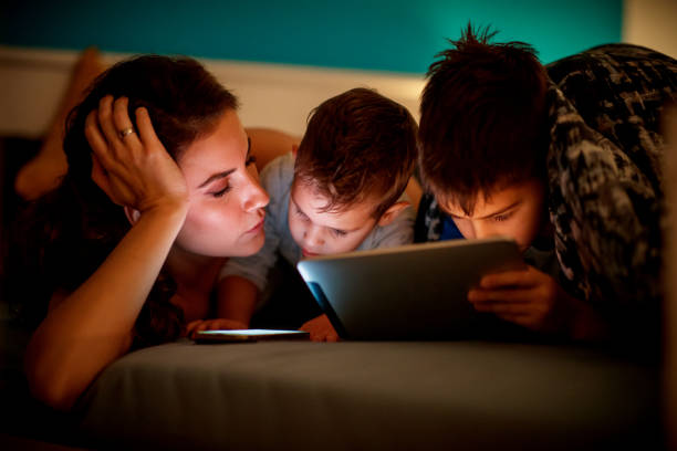 istock Tired mum lying next to her children 1192035799