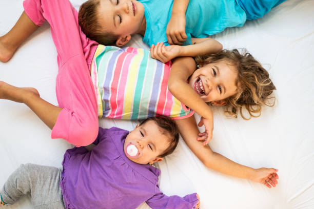 istock Happy playful kids in bedroom 1192037495