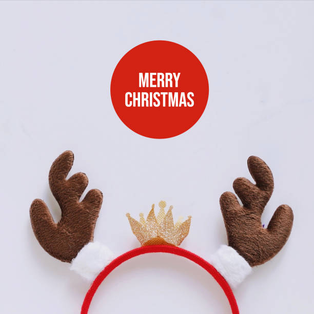 istock Fancy headband with reindeer antler decorative shape for christmas party and celebration on white marble background, Merry Christmas concept 1192038468