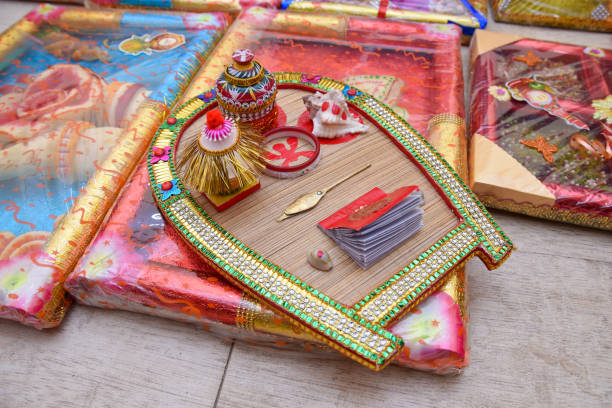 istock Bengali bride holding wedding accessories or Traditional Wedding Invitation card including sindoor box in Indian wedding 1192038868