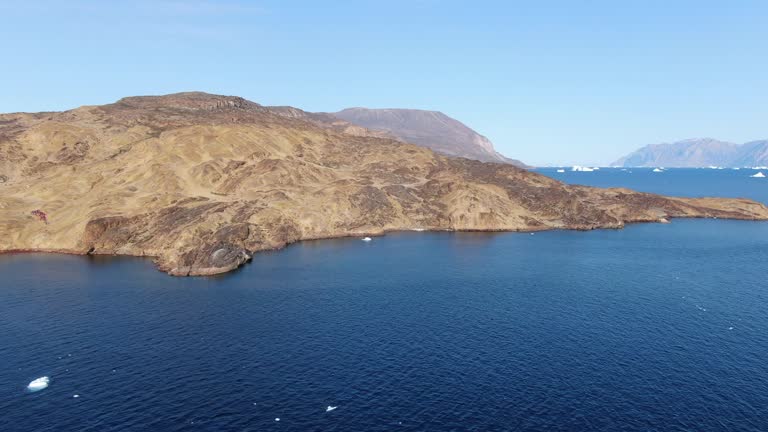 Panoramic view of Akulleq island, Greenland. Aerial drone footage of natural arctic landscape coasting Baffin Sea